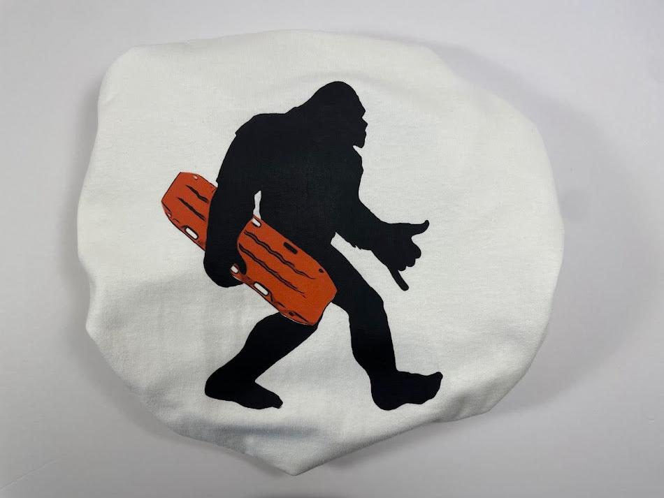 bigfoot with Trax on white shirt indoors